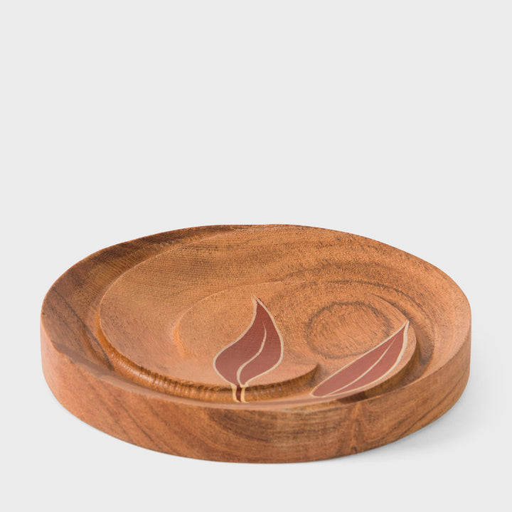 Handcrafted matte indigo round mango wood wall mirror with a hand-carved beaded frame by Mela Artisans.