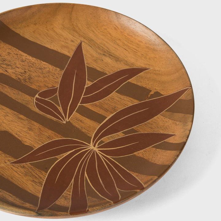  Close-up view of hand painted botanical leaf artwork and smooth natural acacia wood finish  