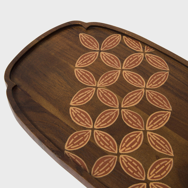  Close-up of scalloped rim profile and hand painted terracotta and cream leaf detail on natural wood