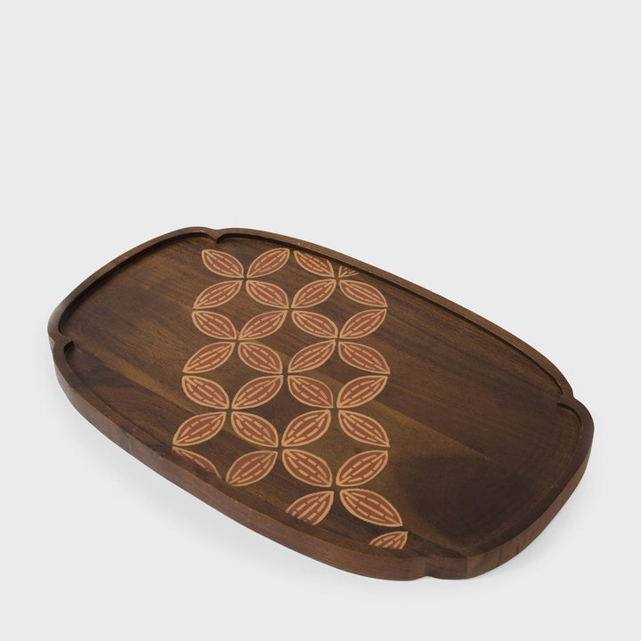  Close-up of scalloped rim profile and hand painted terracotta and cream leaf detail on natural wood