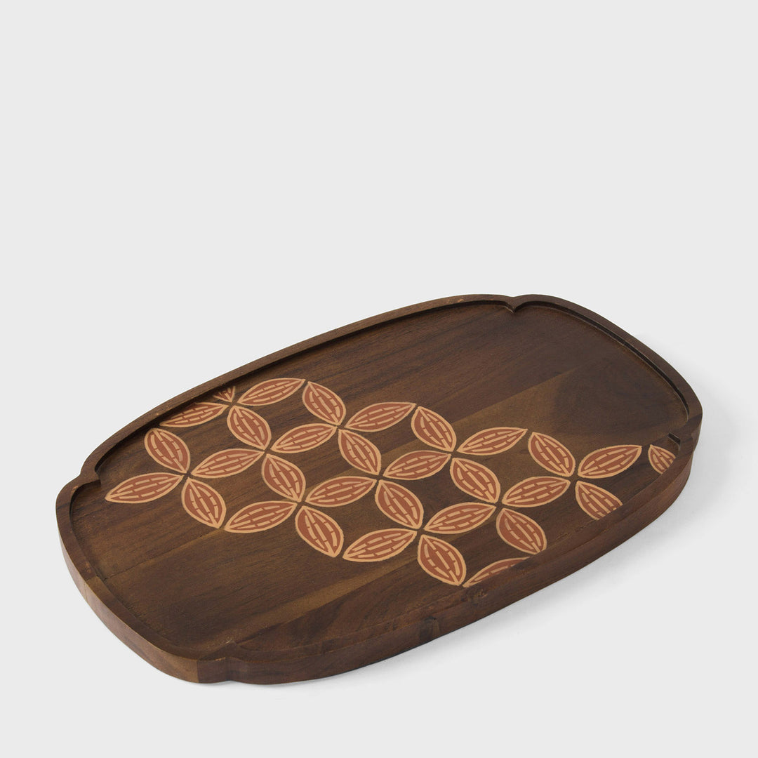  Close-up of scalloped rim profile and hand painted terracotta and cream leaf detail on natural wood
