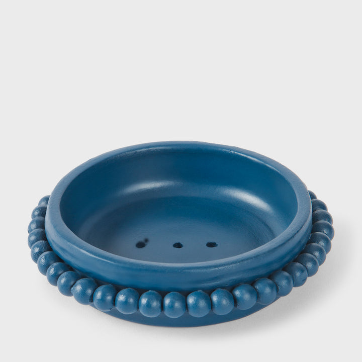 Handcrafted matte indigo terracotta soap dish with a sculptural raised beaded border by Mela Artisans.