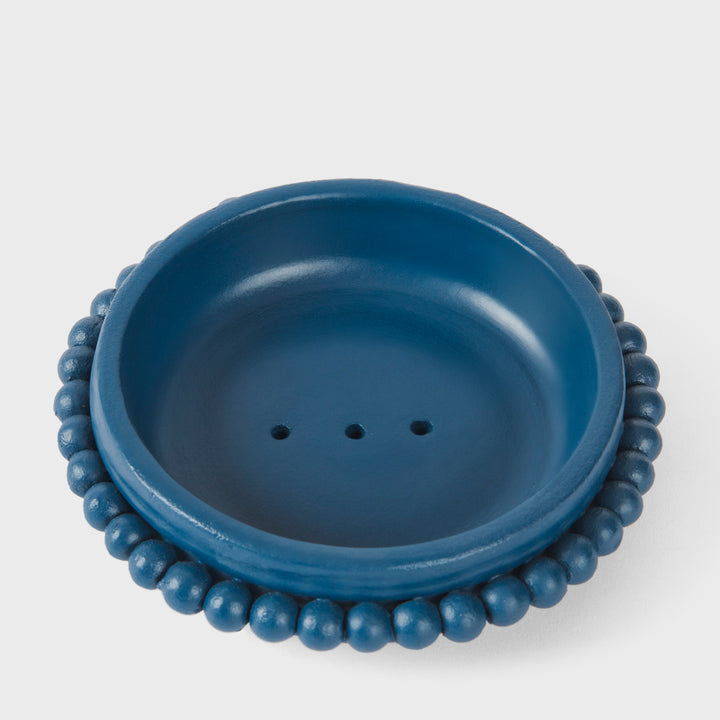 Handcrafted matte indigo terracotta soap dish with a sculptural raised beaded border by Mela Artisans.