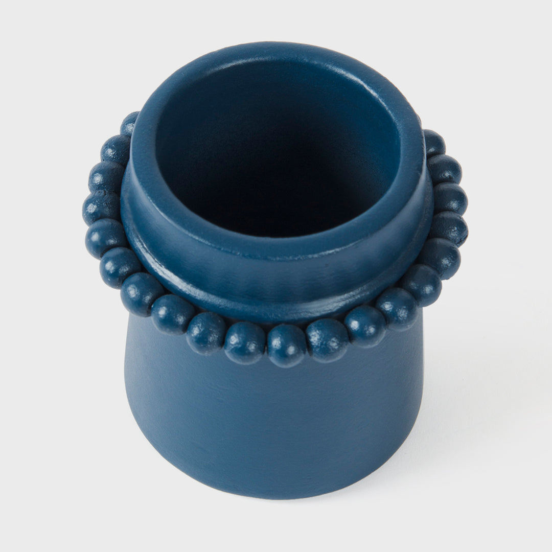 Handcrafted matte indigo terracotta toothbrush holder with sculptural raised beaded detailing by Mela Artisans.