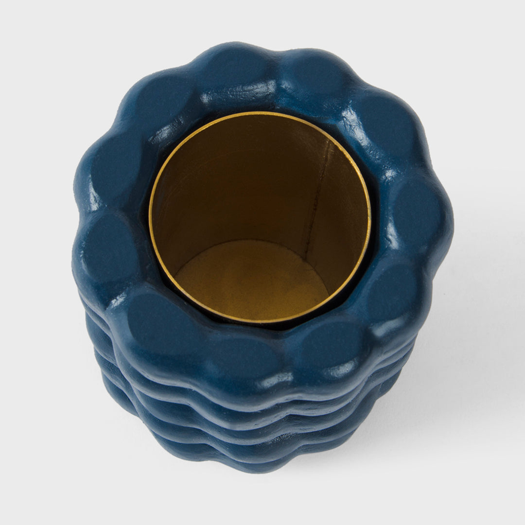 Close-up of the handcrafted terracotta utility holder highlighting its matte indigo glaze, stacked bubble texture, and hand-finished ceramic craftsmanship.