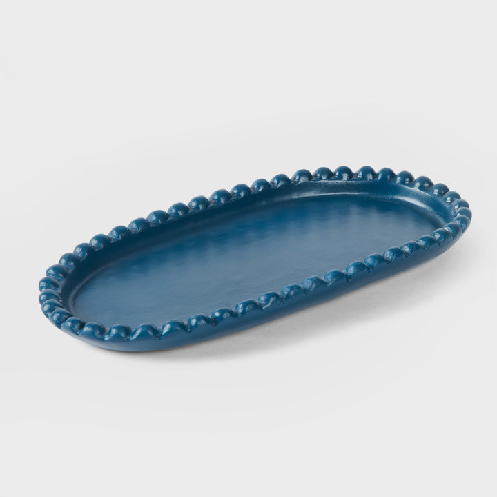 Handcrafted matte indigo terracotta oval serving platter with hand-sculpted raised beaded rim by Mela Artisans.