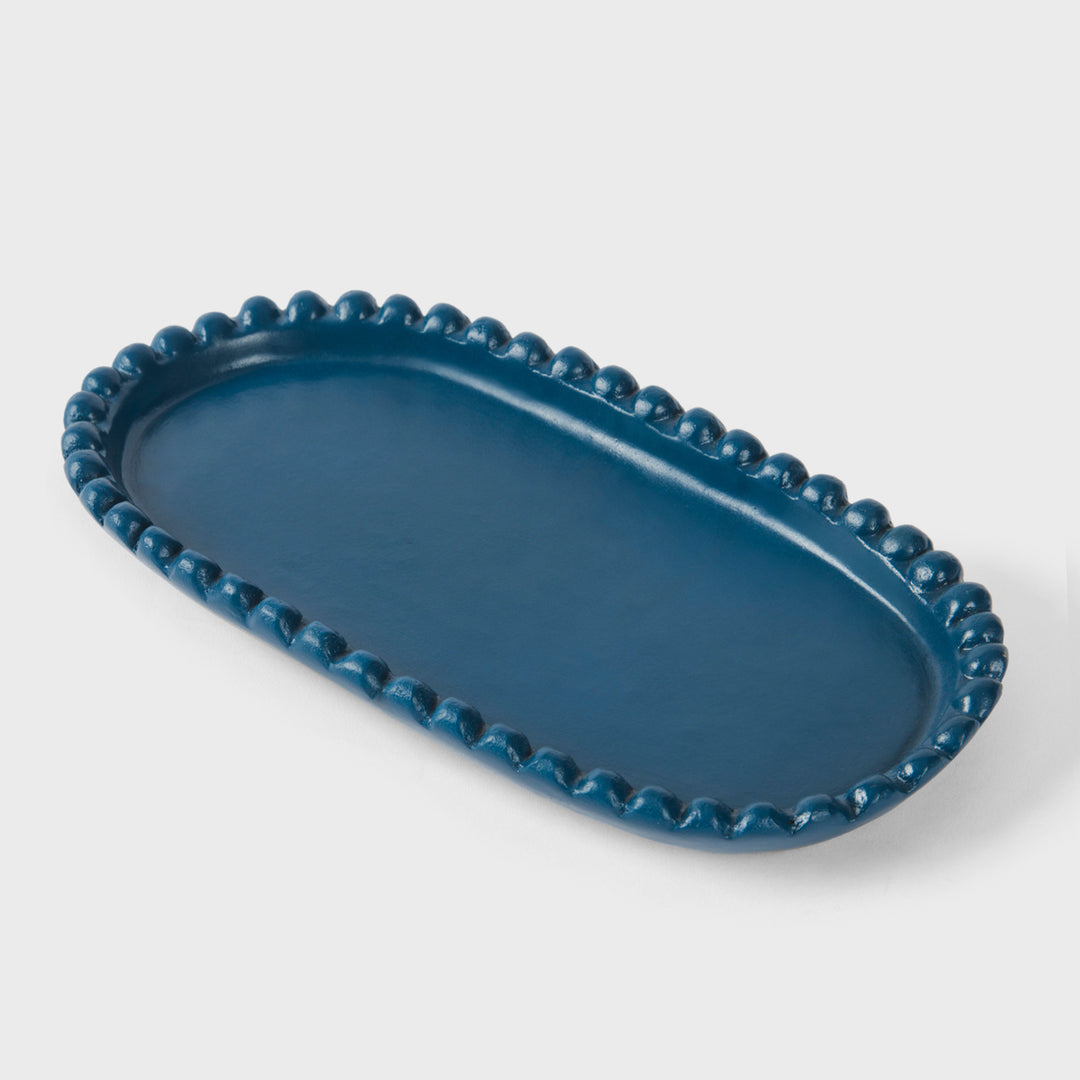 Handcrafted matte indigo terracotta oval serving platter with hand-sculpted raised beaded rim by Mela Artisans.