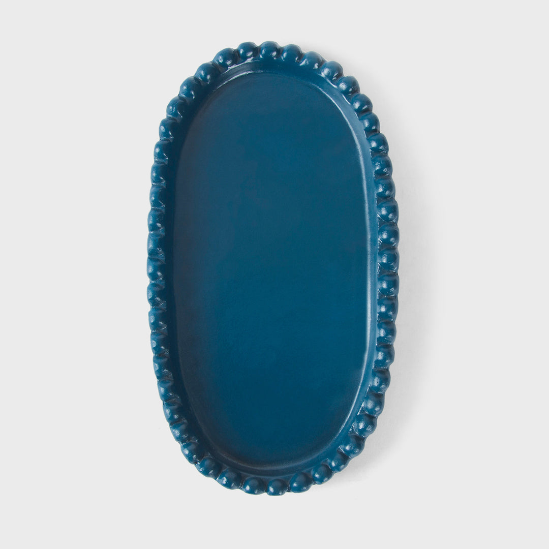 Handcrafted matte indigo terracotta oval serving platter with hand-sculpted raised beaded rim by Mela Artisans.