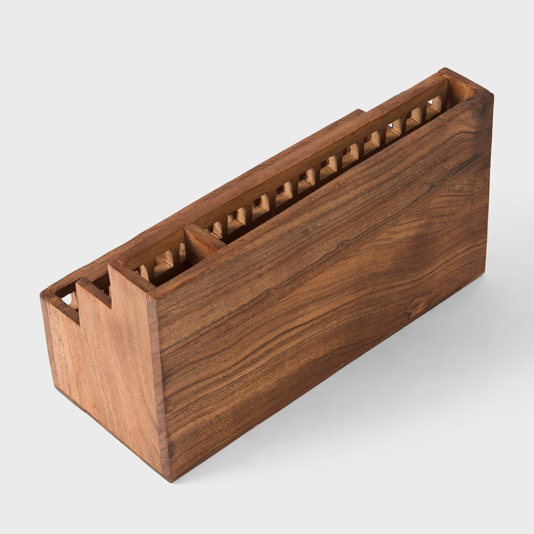 Close-up of grid cutout pattern and natural acacia wood grain texture