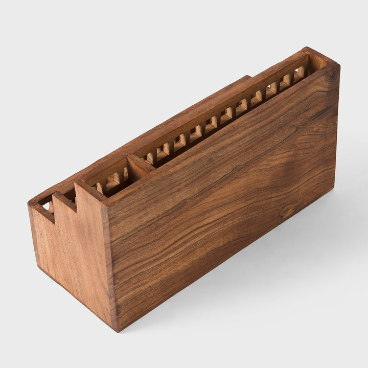Close-up of grid cutout pattern and natural acacia wood grain texture
