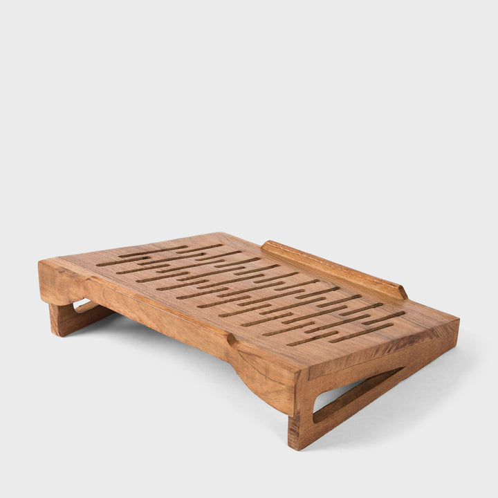  Hand carved natural acacia wood laptop stand with sloped ventilation slots on white background  