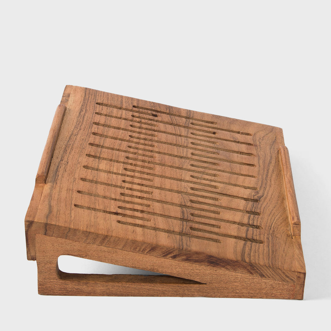Close-up of smooth natural acacia wood grain texture and carved ventilation slots 