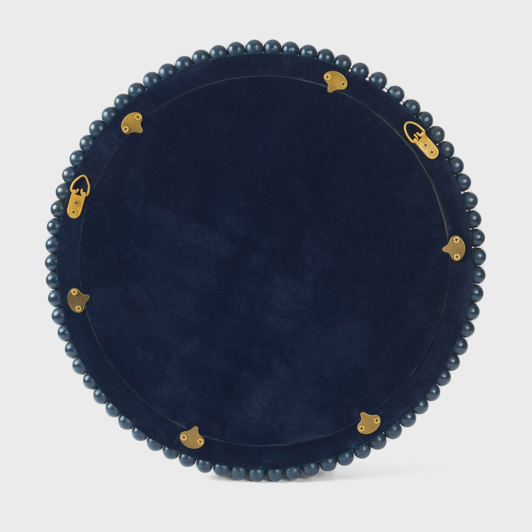 Close-up of the handcrafted mango wood wall mirror showcasing the matte indigo finish, hand-carved beaded border, and premium mirrored glass.