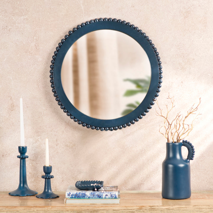 Handcrafted indigo mango wood wall mirror displayed above a console table in an artisan-inspired entryway with coordinated home décor.

