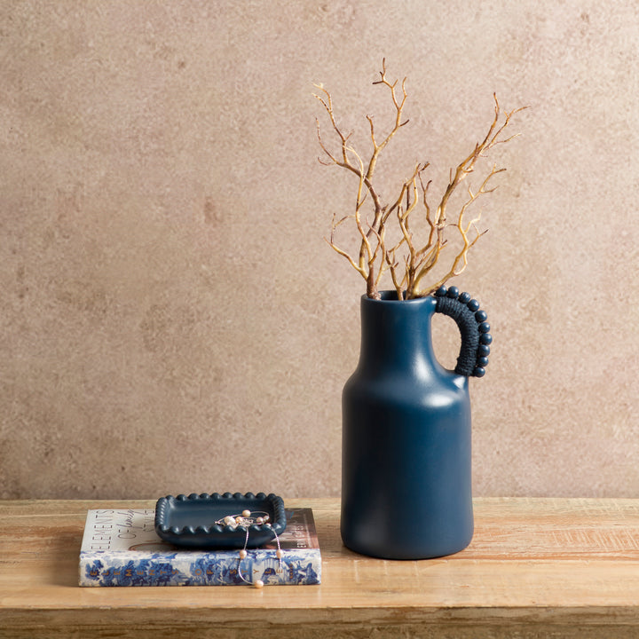 Handcrafted indigo terracotta trinket tray styled on a vanity holding jewelry and everyday essentials.