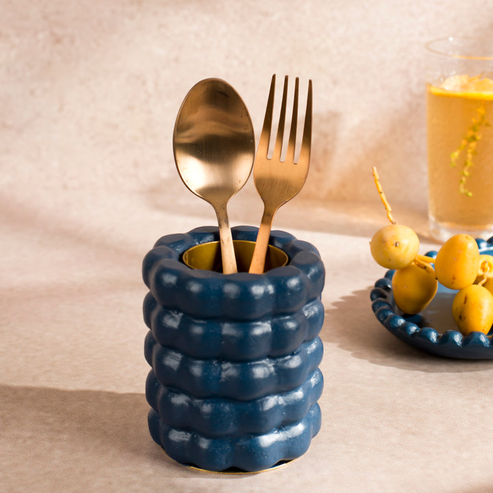 Handcrafted terracotta utility holder styled with gold flatware on a dining table, showcasing artisan craftsmanship and functional tabletop storage.