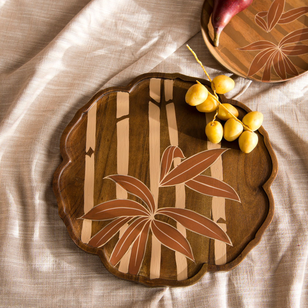 Bamboo Grove round wood tray styled on a coffee table displaying artisan crackers and fruit  