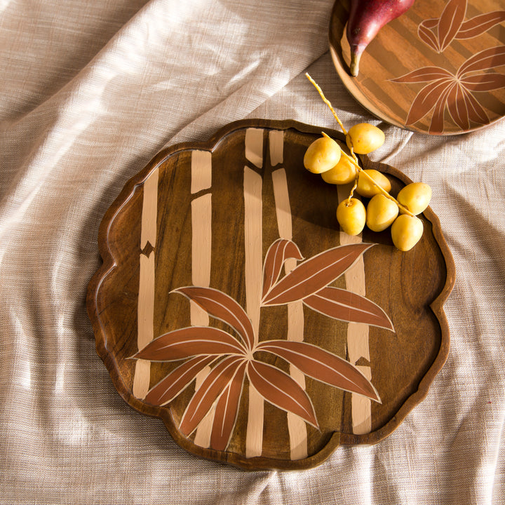 Bamboo Grove round wood tray styled on a coffee table displaying artisan crackers and fruit  