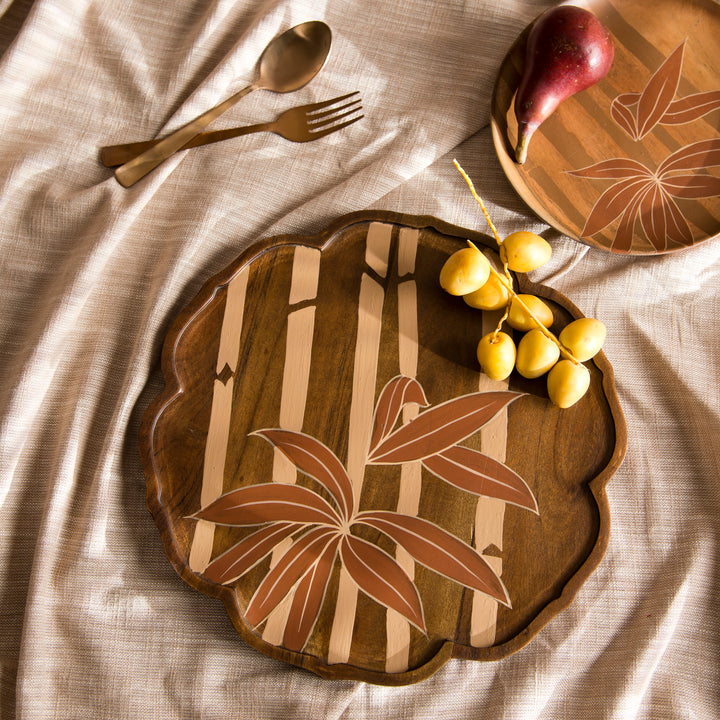 Bamboo Grove round wood tray styled on a coffee table displaying artisan crackers and fruit  