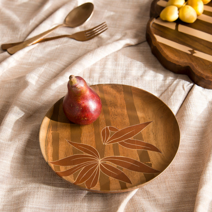 Pair of Bamboo Grove wood plates styled on a dining table serving appetizers and bread