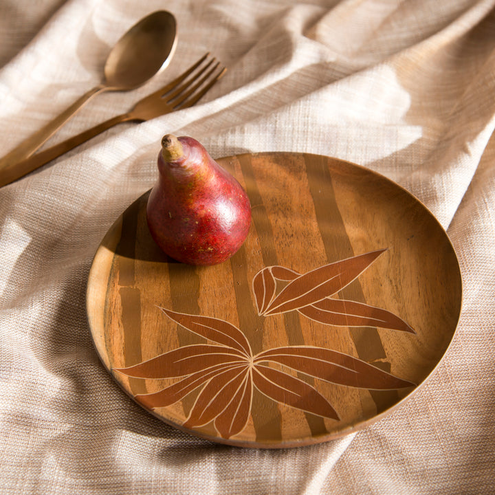 Pair of Bamboo Grove wood plates styled on a dining table serving appetizers and bread