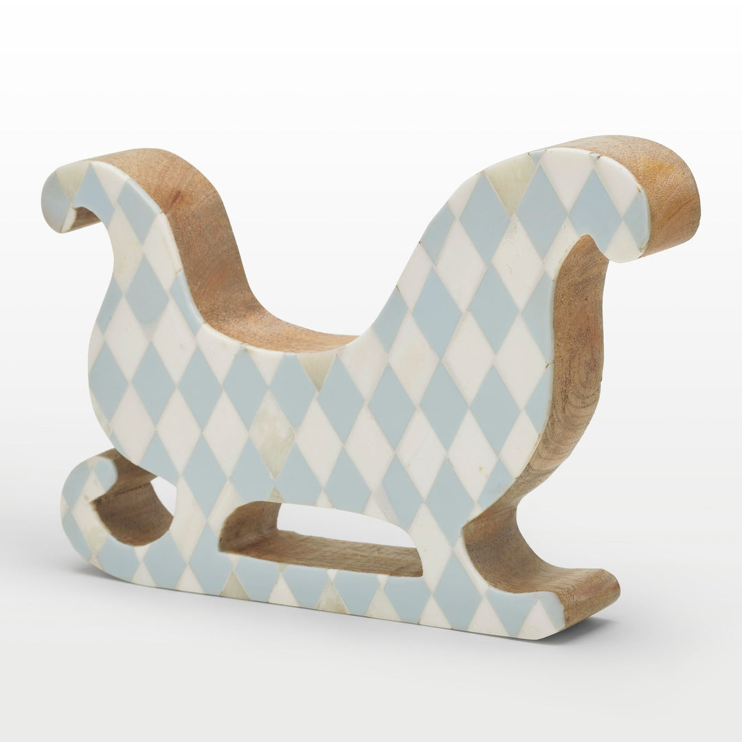 Close-up of handcrafted teal resin and white bone inlay diamond pattern on the sleigh contour 
