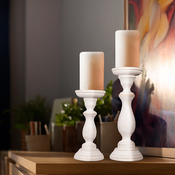 close-up of shabby white distressed finish on candleholders
