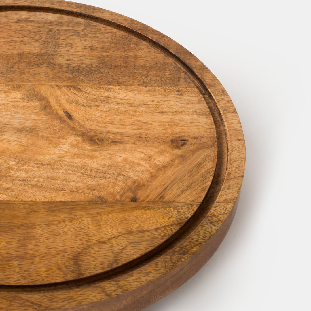 Close-up of wood grain and footed rotating base
