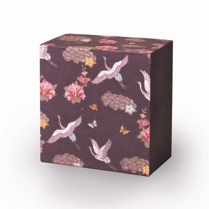 Close-up of printed floral and bird artwork on gift box
