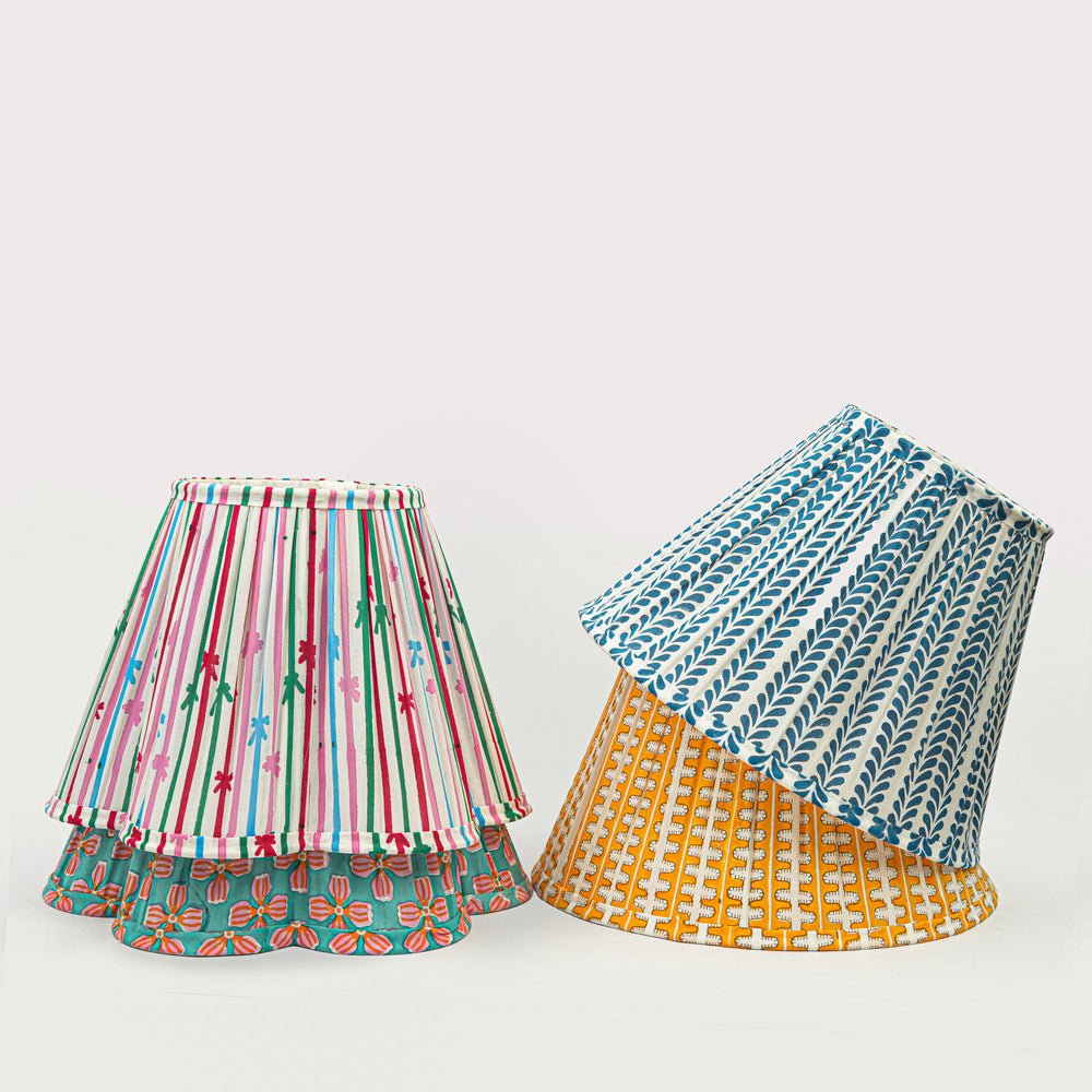 Two colorful lampshades on a white background