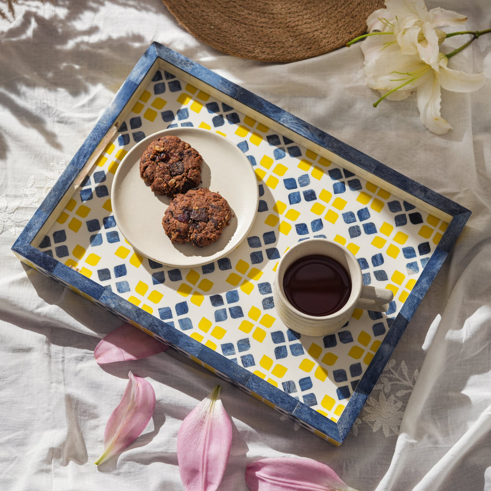 Colorful mosaic tray styled on a coffee table with décor accents