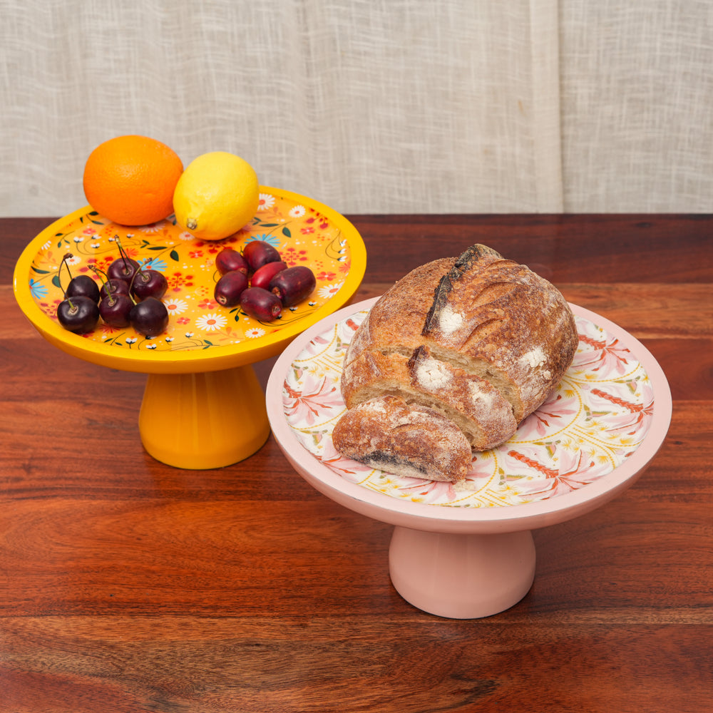 Cake stand styled with desserts on table
