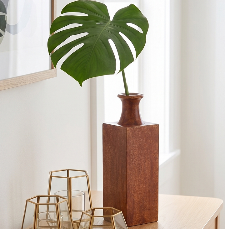 Mangowood decorative vase displayed on wooden coffee table in cozy living room settin