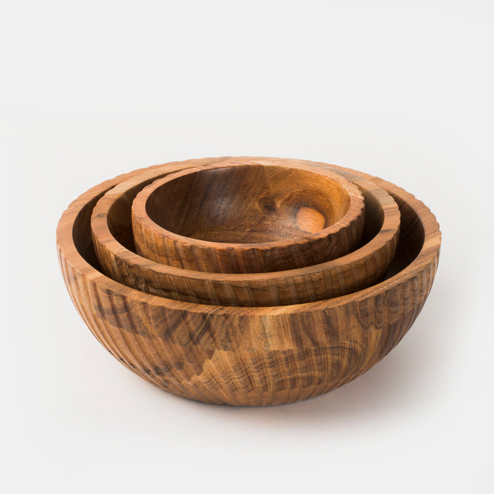 Set of three acacia wood serving bowls nested together