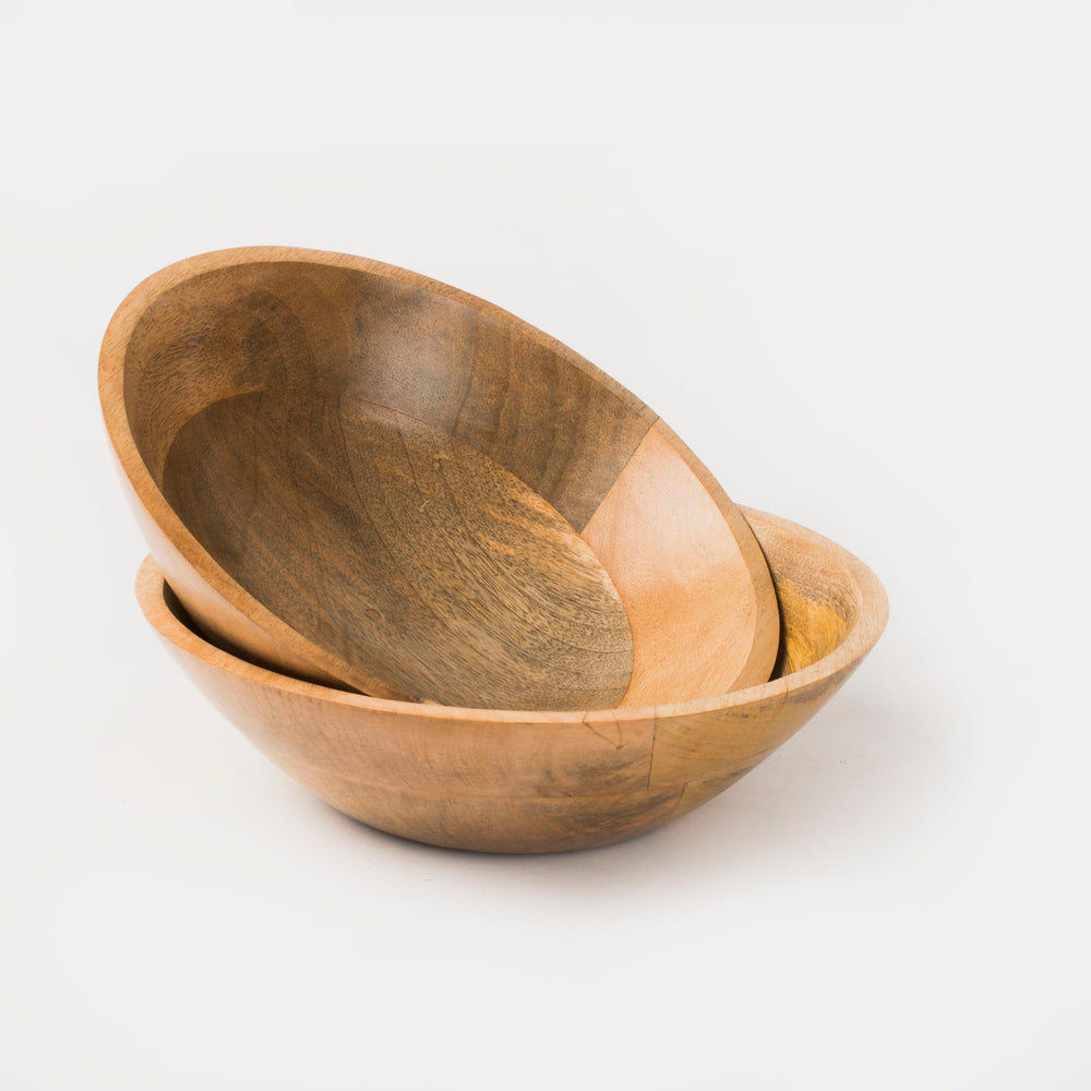 Two mango wood bowls in a natural finish, one stacked inside the other, isolated on a white background.