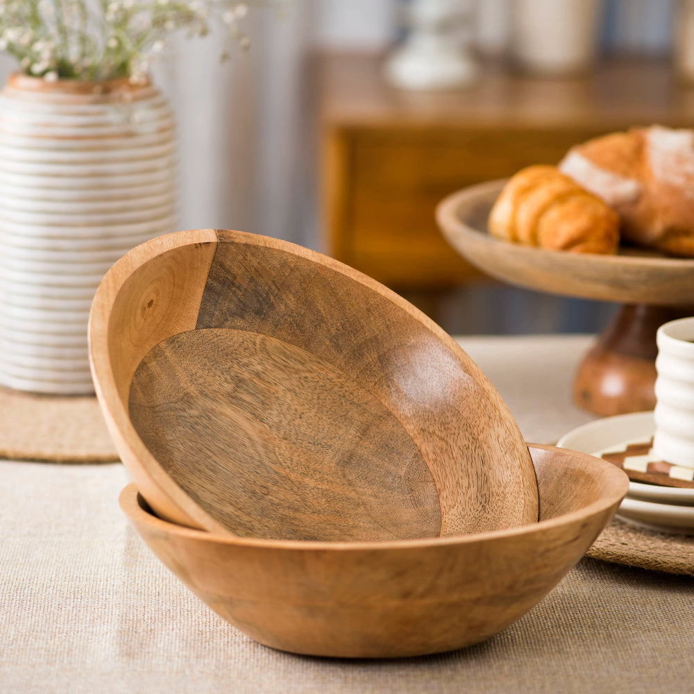 Side view of the Woodform stackable bowl showing the natural wood grain and smooth curved edges.