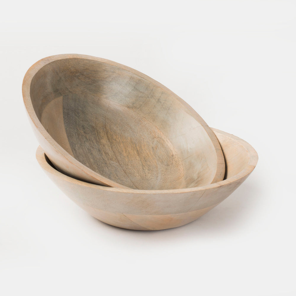 Overhead view of a round handcrafted mango wood bowl in grey, perfect for serving snacks or side dishes.