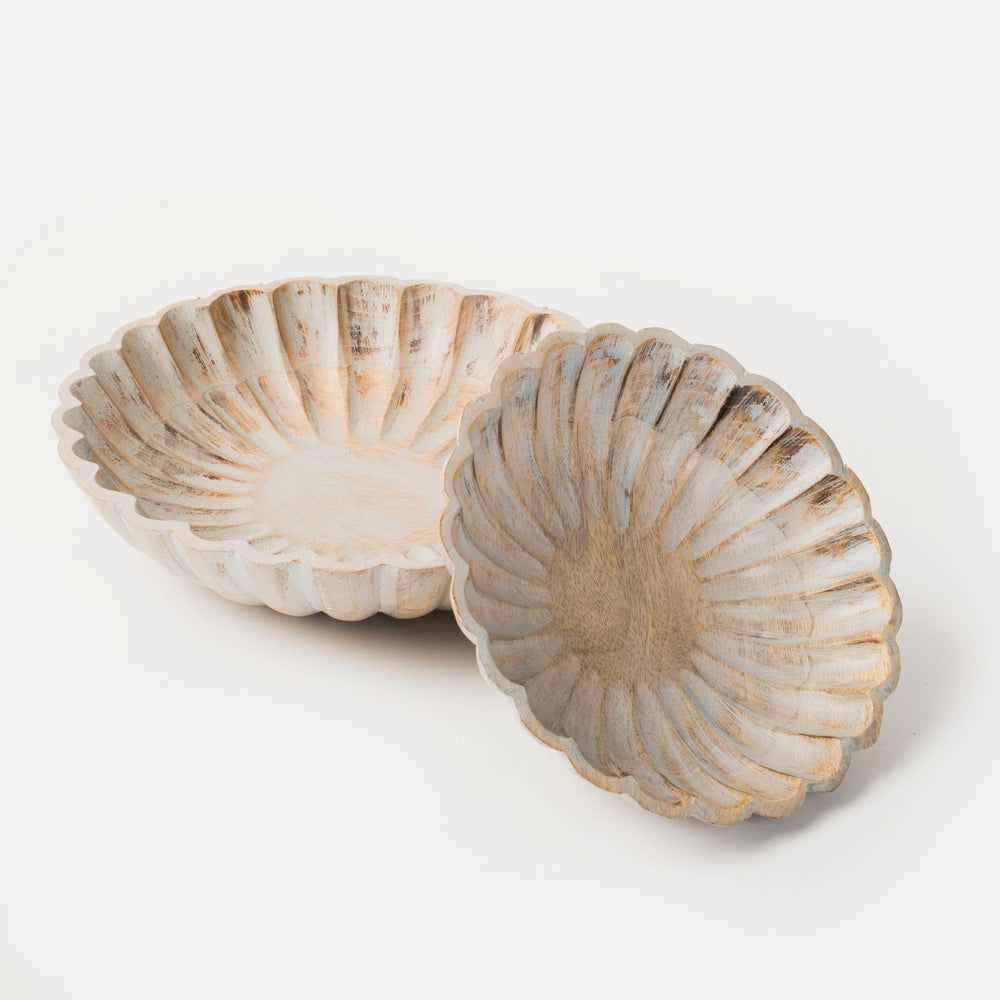 Set of two hand-carved scalloped mango wood bowls nested together