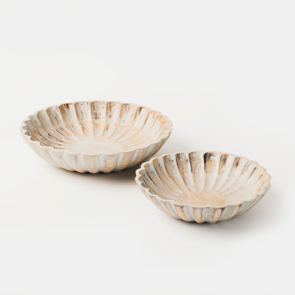 Set of two hand-carved scalloped mango wood bowls nested together