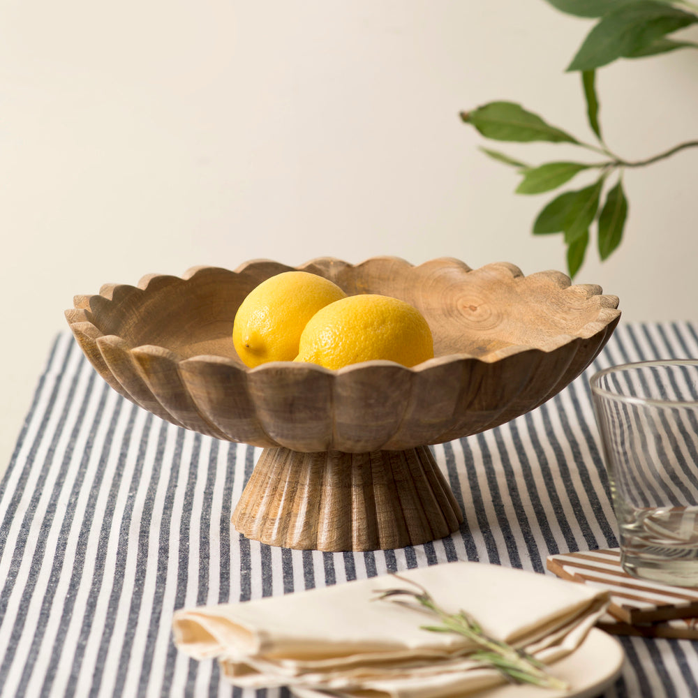 Pedestal bowl styled as a centerpiece on a dining table