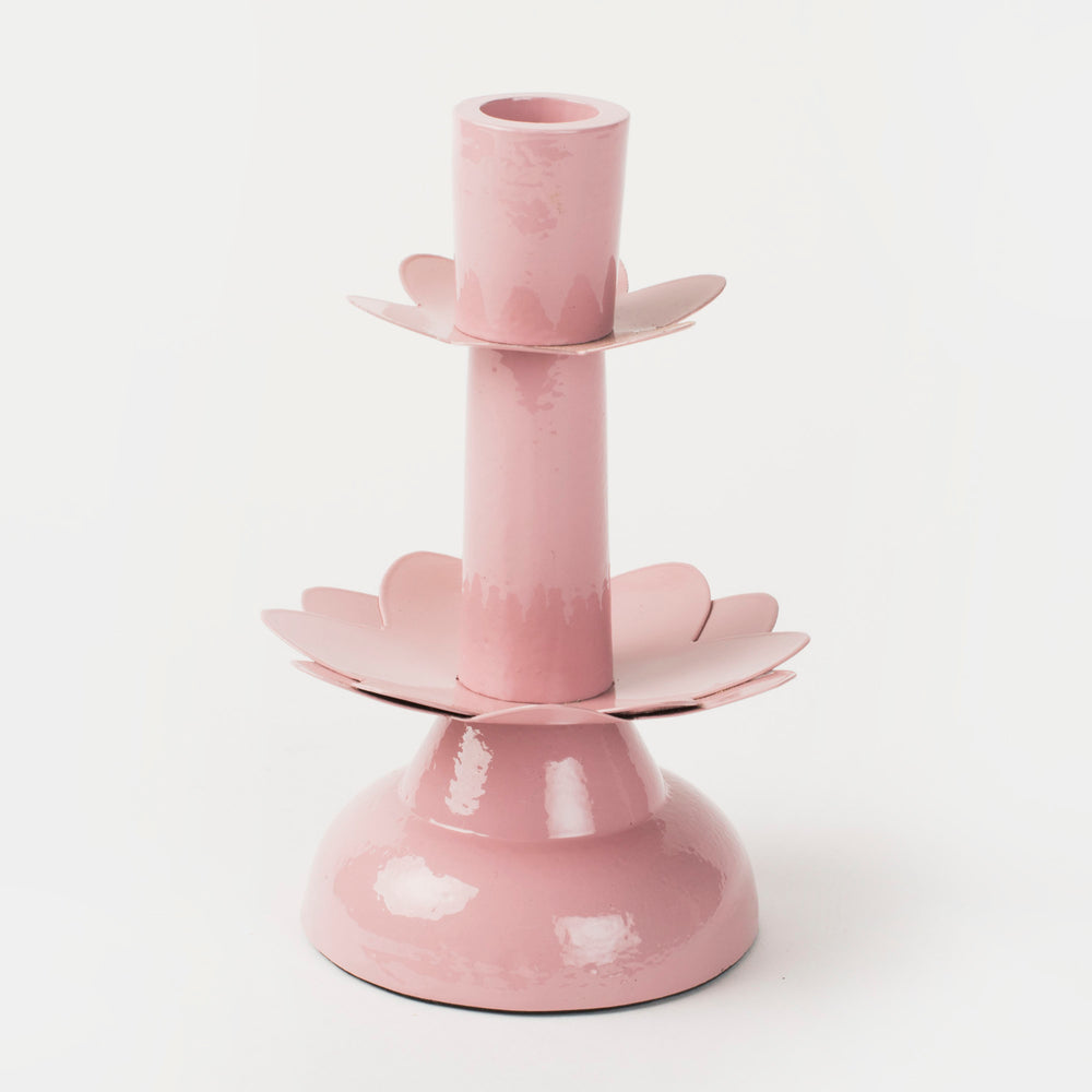 Hand-finished soft pink aluminum candleholder with a sculptural tiered petal design inspired by a blooming lotus.
