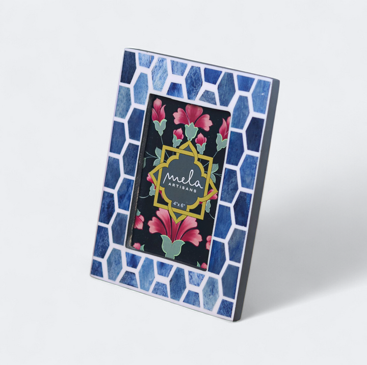 Gramercy photo frames displayed on tabletop with family photographs
