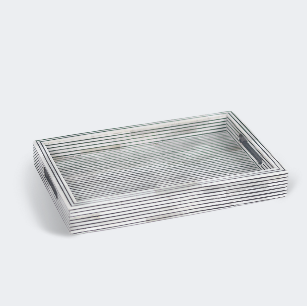 Pinstripe photo frames displayed on tabletop with family photographs
