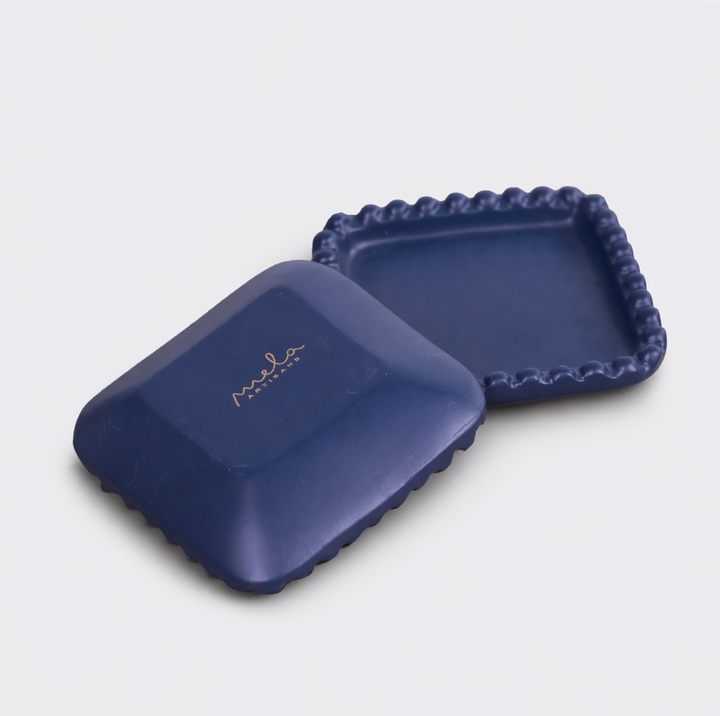  Indigo beaded terracotta trays styled on dresser holding jewelry and small accessories
