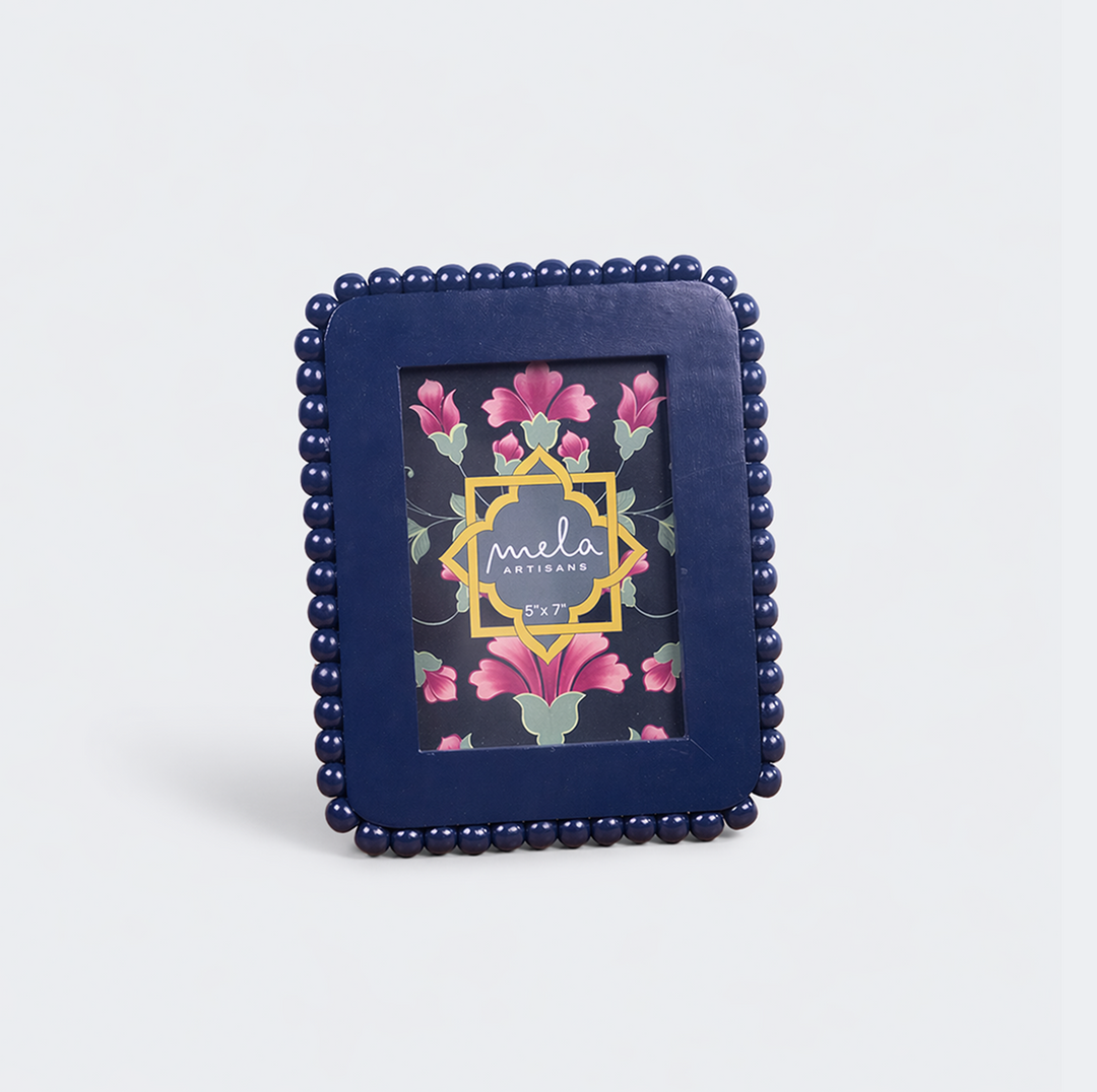  Raatriti beaded photo frames displayed on tabletop with family photographs
