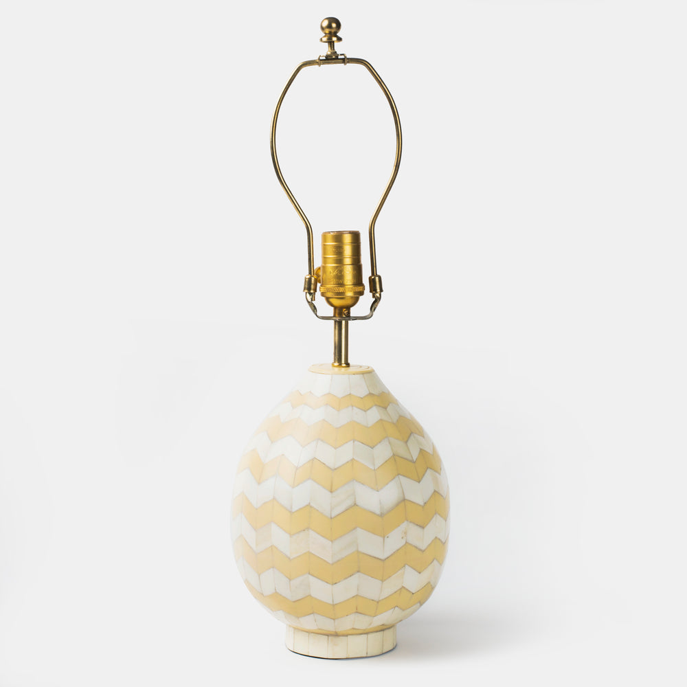 Front view of the Herringbone Inlay Table Lamp Base featuring a curved gourd shape with a handcrafted ivory and beige chevron pattern and brass hardware.