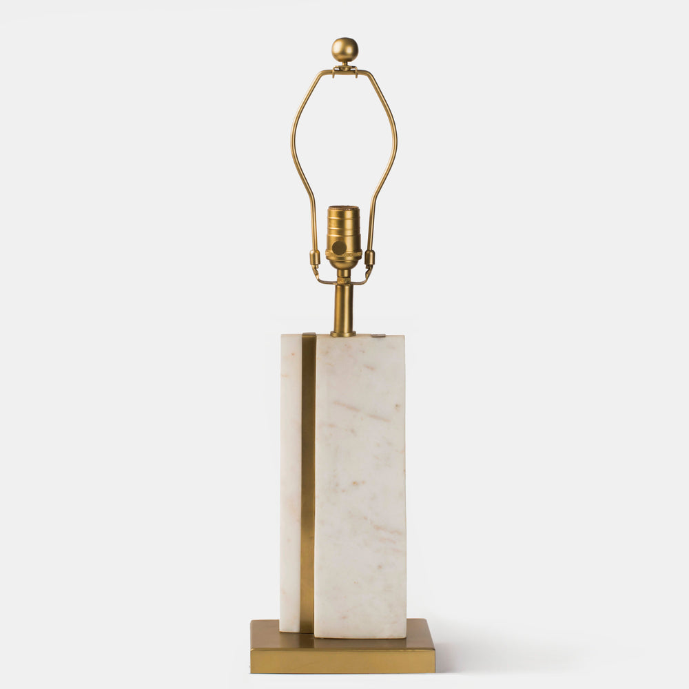 Front view of the Sculpta Marble Lamp Stand featuring a tall, rectangular white marble body with a polished brass base and neck.