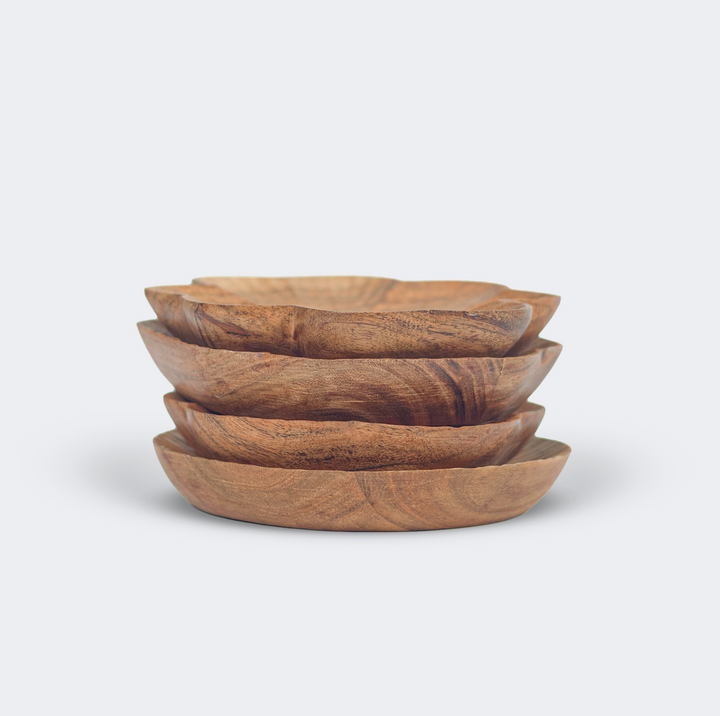  Close-up of hand-carved textured surface and natural wood grain on a scalloped wooden dish