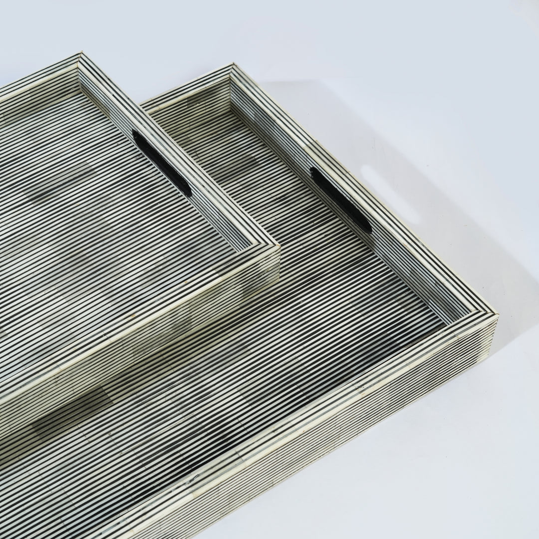 Close-up of pinstripe bone inlay craftsmanship on white tray