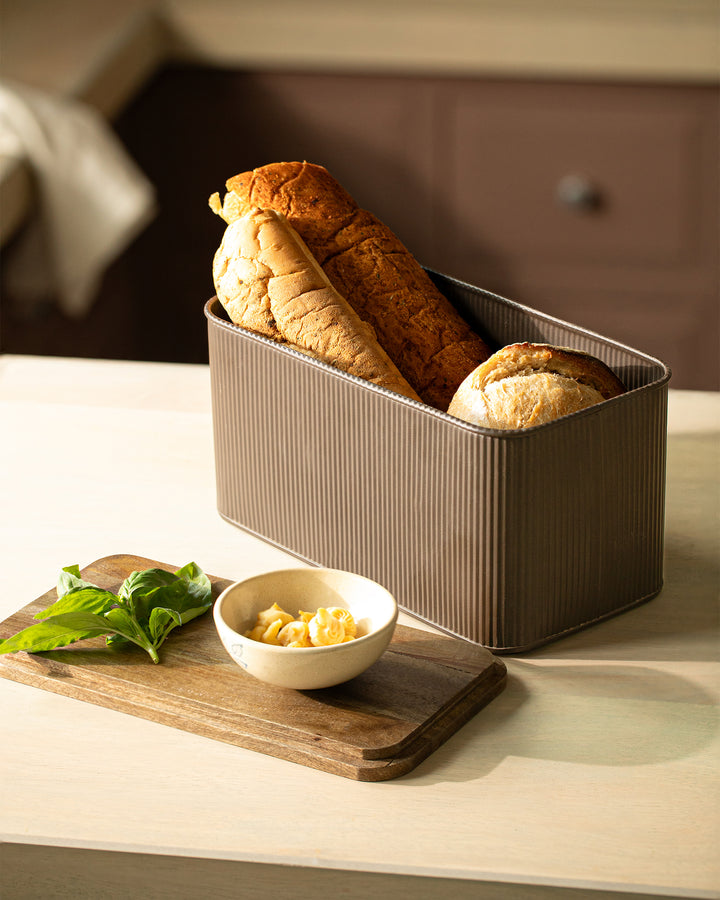 wooden bread box styled on kitchen countertop
